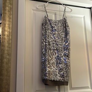 BCBG MaxAzria grey silk spaghetti strap slip dress with silver sequin overlay.